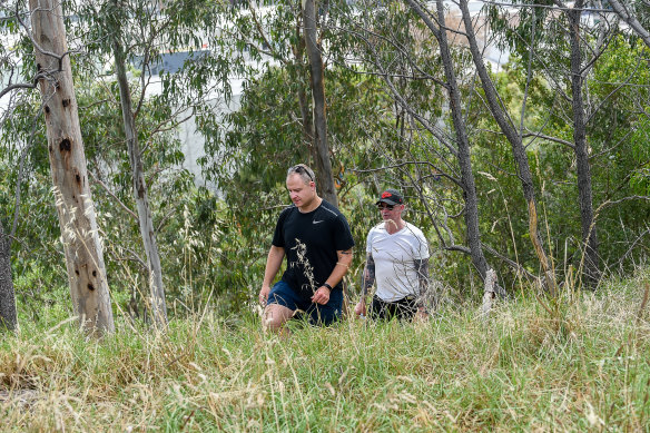 Officers from the missing persons unit search Darebin Creek Reserve on Thursday.