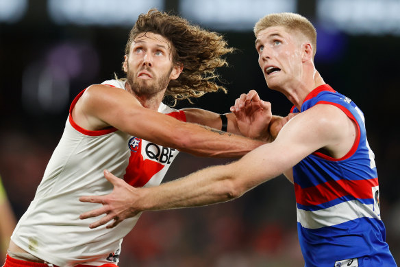 Swan Tom Hickey and the Bulldogs’ Tim English compete in a ruck contest  before Hickey suffered a knee injury later in the round 3 match.