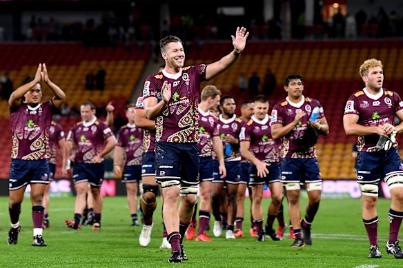 Reds second Angus Blyth celebrates with teammates after their victory over the Brumbies in 2020.