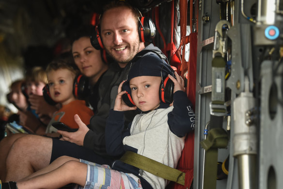 January 5: Meaghan Wegg, Tim Buckley and their children Georgia and Jackson on an ADF Chinook helicopter. 