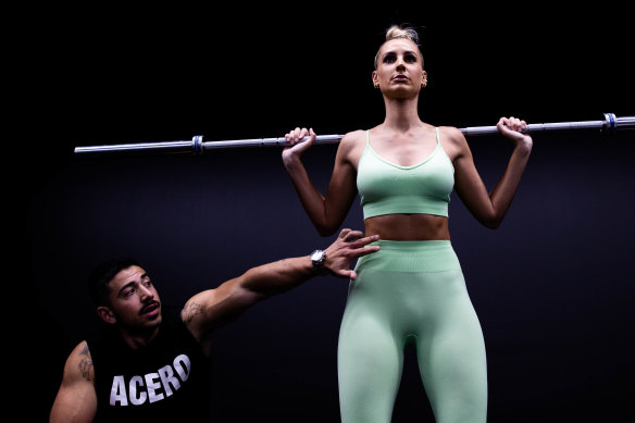Personal trainer Jono Castano with model Laura Dundovic.