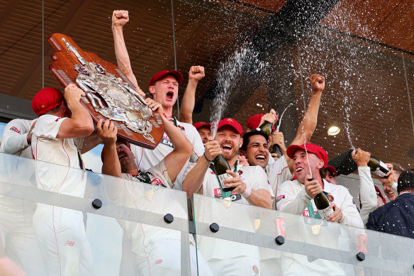 South Australia players celebrate with the Shield.