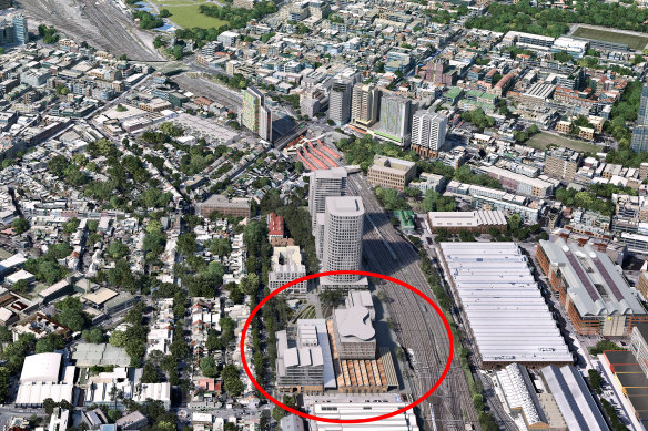 An artist’s impression of one of the options for the redeveloped Redfern-North Eveleigh rail precinct (circled) with the new building on top of the saw-tooth roof of the Paint Shop warehouse.