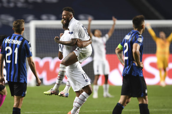 Neymar celebrates with Eric Maxim Choup-Moting, who scored the winner for PSG.