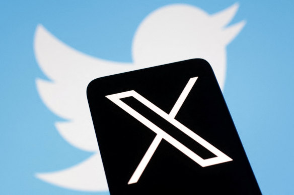 Musk’s new logo, X, crosses out  Twitter’s blue bird. 