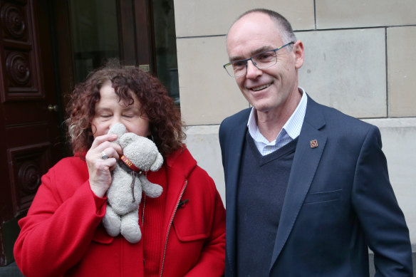 Robyn (clutching a teddy that belonged to Patrick as a child) and Matt Cronin leave the Supreme Court on Thursday,