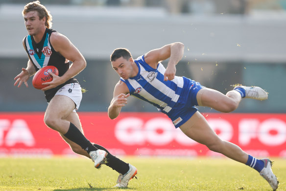 Jason Horne-Francis, left, runs with the ball in Hobart.