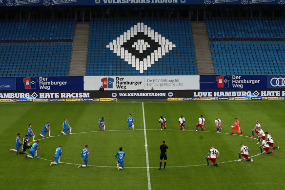 Players from two Bundesliga teams kneel in solidarity with protests over the death of George Floyd.