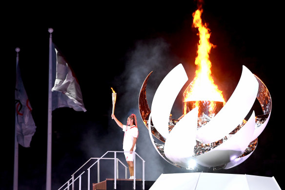 Naomi Osaka lights the Olympic cauldron.