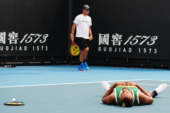 Nick Kyrgios of Australia collapses at the end of his training session.
