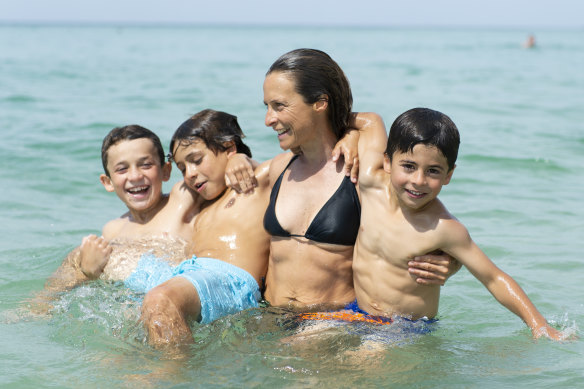 Sam Bloom with her sons in Thailand in 2013, shortly before the accident that would change her life. 