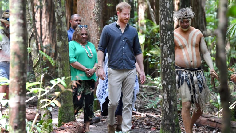 Prince Harry is guided through the forest by Butchulla locals.