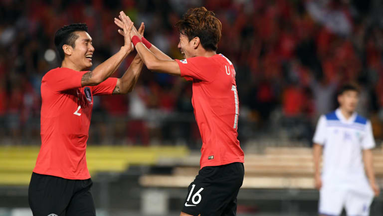 Hwang Ui-jo of Korea Rebublic  (right) celebrates after scoring a goal with Lee Yong (left)  during their win against Uzbekistan at QSAC.