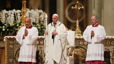 Pope Francis presides over an Easter vigil ceremony in St. Peter's Basilica at the Vatican.