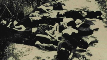 My Lai Massacre Scene: Bodies of woman and children on road leading from village of My Lai in South Vietnam in March 1968.