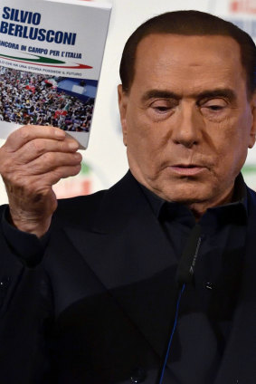 Former Italian PM Silvio Berlusconi addresses a rally in Milan ahead of Italy's general elections.