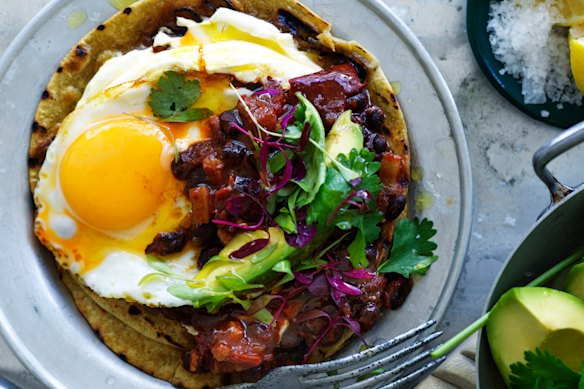 Neil Perry’s chilli-fried black beans with avocado and egg.