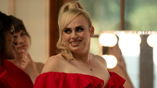 Rebel Wilson is a spy masquerading as someone who designs plinths for cat shows in Bride Hard.