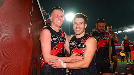 MELBOURNE, AUSTRALIA - MAY 23: Angus Clarke of the Bombers celebrates his first game and win with Zach Merrett after the round 11 AFL match between Essendon Bombers and Richmond Tigers at Melbourne Cricket Ground, on May 23, 2025, in Melbourne, Australia. (Photo by Quinn Rooney/Getty Images)