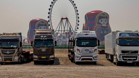 Trucks from Russia and Belarus wait for custom clearance at a parking lot in Manzhouli, a Chinese town on the border of Russia. 