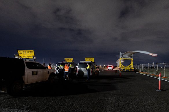 The police and pilots gather before the start of the turbine blade’s trip from Newcastle port to the Uungula wind farm near Wellington in NSW