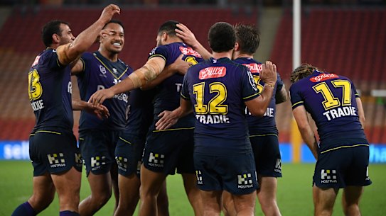 Storm players celebrate a Jesse Bromwich try in the 27-point demolition of Penrith.