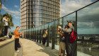 Tourists and locals at Queen’s Wharf in Brisbane this week. But much of the complex is still closed, and is opening in stages.