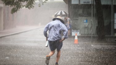 Shorts in a storm: Melbourne’s tropical weather in action this summer.