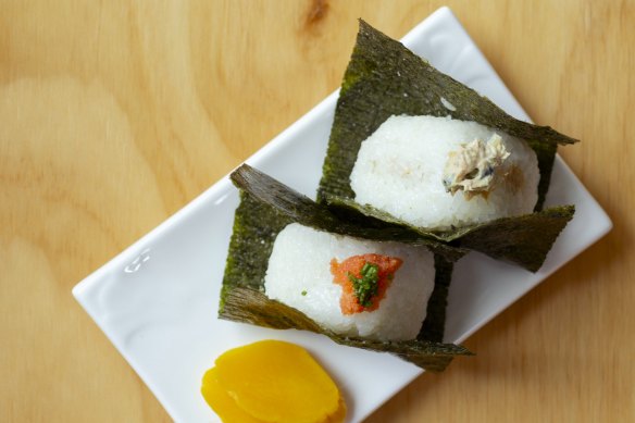Onigiri at Domo 39, with small clues about their filling dotted on the top.