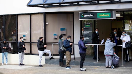 Queues outside a Sydney Centrelink office. The unemployment rate is set to fall below 4 per cent.