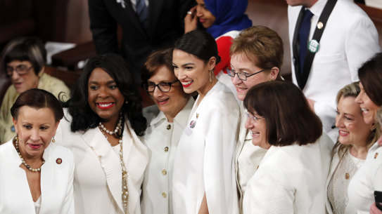 Democratic members of Congress, including Rep. Alexandria Ocasio-Cortez, D-N.Y., center, pose for a photo before President Donald Trump delivers his State of the Union address to a joint session of Congress on Capitol Hill in Washington, Tuesday, Feb. 5, 2019. (AP Photo/J. Scott Applewhite)