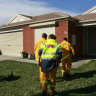 CFA men visit homes to monitor gas levels at Brookland Greens in Cranbourne in 2008.