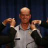 Then-premier John Brumby (left) and police minister Bob Cameron with newly appointed police chief Simon Overland in 2009.