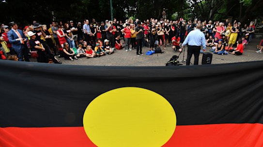 Wangan and Jagalingou traditional owners and their supporters are seen protesting outside Parliament House in Brisbane, Thursday, March 8, 2018. The Wangan and Jagalingou people are calling on the Queensland government to rule out extinguishing their native title in favour of Adani's Carmichael coal mine. (AAP Image/Darren England) NO ARCHIVING
