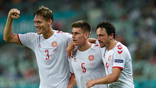 Denmark’s players celebrate their win. 