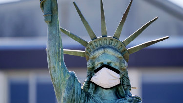 A face mask has been placed on a replica of the Statue of Liberty in Seattle. 