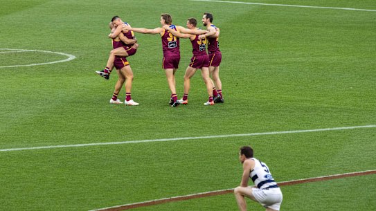 The Lions celebrate on the siren.