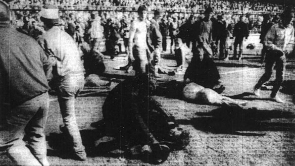 The scene of devastation as rescue workers attend to fans - Clipped from The Age, April 17, 1989.