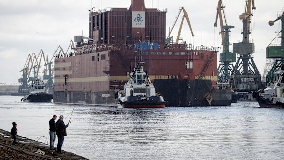 The floating nuclear power plant, the 'Akademik Lomonosov', is towed out of the St Petersburg shipyard on  Saturday.