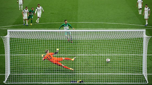 Nikita Rukavytsta puts a penalty past Tottenham Hotspur goalkeeper Joe Hart in the Europa League.