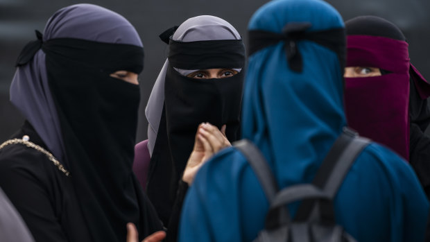 A protest group takes part in a demonstration against the first fine given for wearing the face veil niqab in Copenhagen.