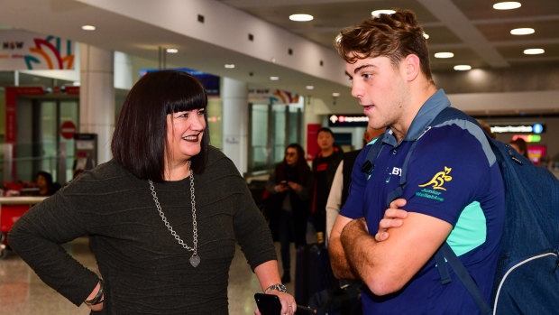 Rugby Australia boss Raelene Castle and Junior Wallabies Fraser McReight have a chat at Sydney Airport on Tuesday. 