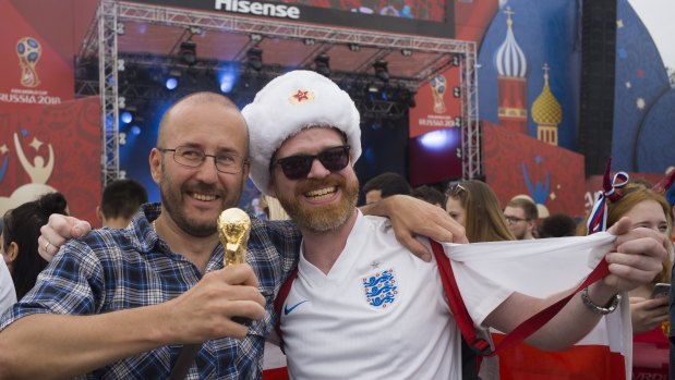 Melting pot: English and Russian fans pose for a photo as they watch the group G soccer match between England and Panama.