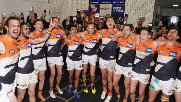 Badlam: GWS players sing the club song after beating Collingwood to qualify for their first grand final.