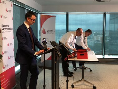 Queensland Electoral Commissioner Pat Vidgen and ECQ staff begin the ballot draw for Brisbane lord mayor.