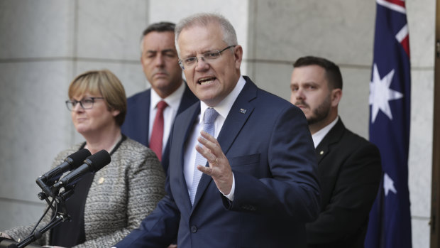 Prime Minister Scott Morrison, Minister for Defence Linda Reynolds, Minister for Veterans and Defence Personnel Darren Chester, second left, and Liberal MP Phil Thompson, right, announcing the national commissioner to examine veteran suicide in February. 