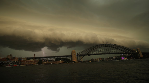 A lightning bolt strikes as a storm cell is seen above the Sydney Harbour Bridge on Saturday