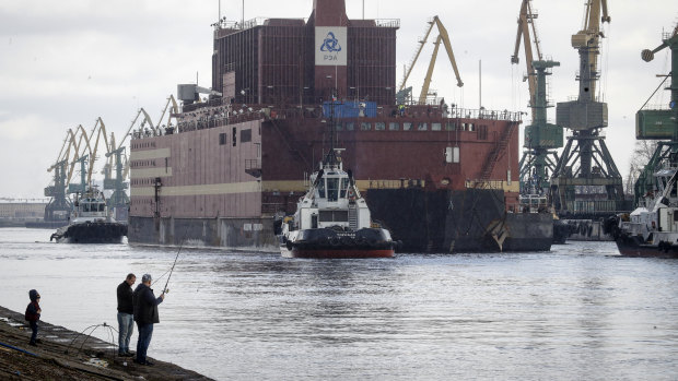 The floating nuclear power plant, the 'Akademik Lomonosov', is towed out of the St Petersburg shipyard on  Saturday.