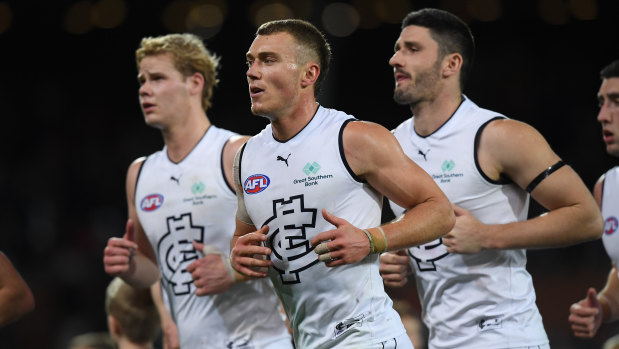 Tom De Koning, Patrick Cripps, and Marc Pittonet against the Crows in round 20.
