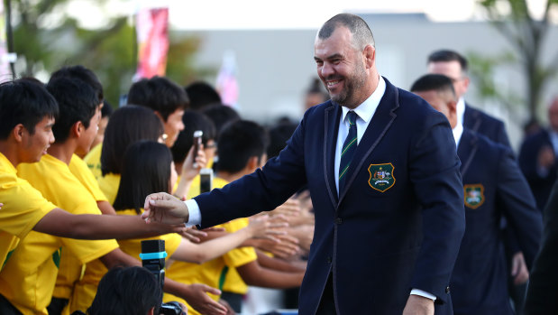 Local children greet Wallabies coach Michael Cheika before the official welcoming ceremony on Wednesday.